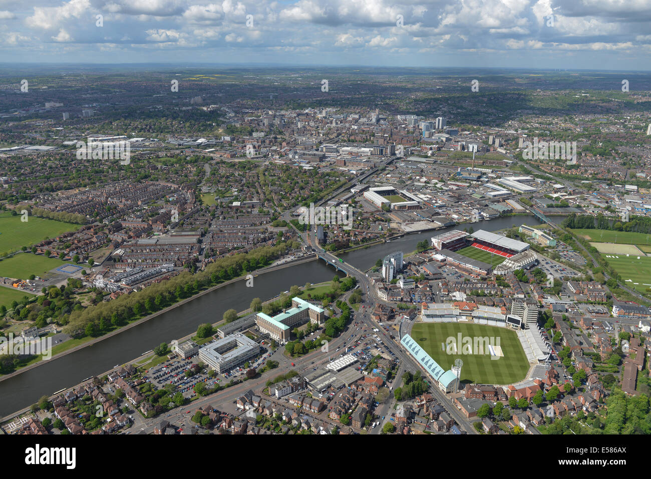 An aerial view looking from Trent Bridge, Nottingham. Both football grounds and the cricket ground visible, city centre behind. Stock Photo