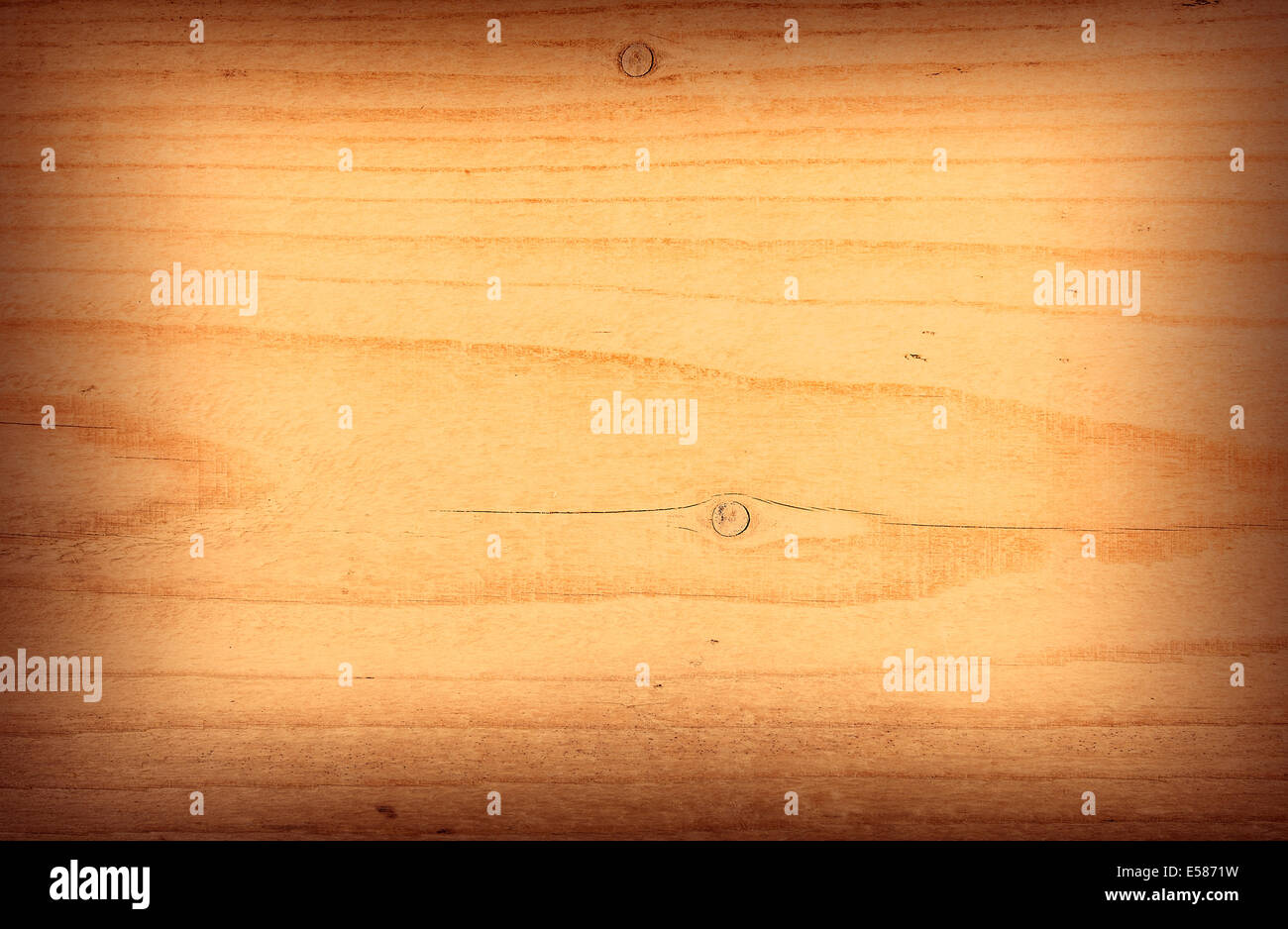 Wood texture in warm colors with vignette on edges Stock Photo