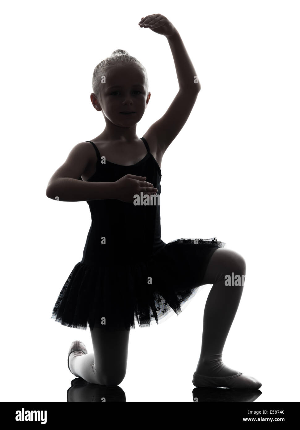one little girl ballerina ballet dancer dancing in silhouette on white