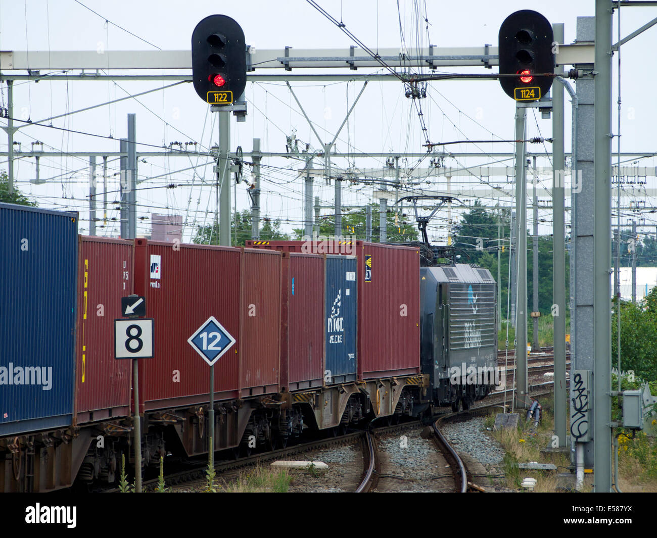 Freight train loaded with containers passing through Breda, the Netherlands Stock Photo