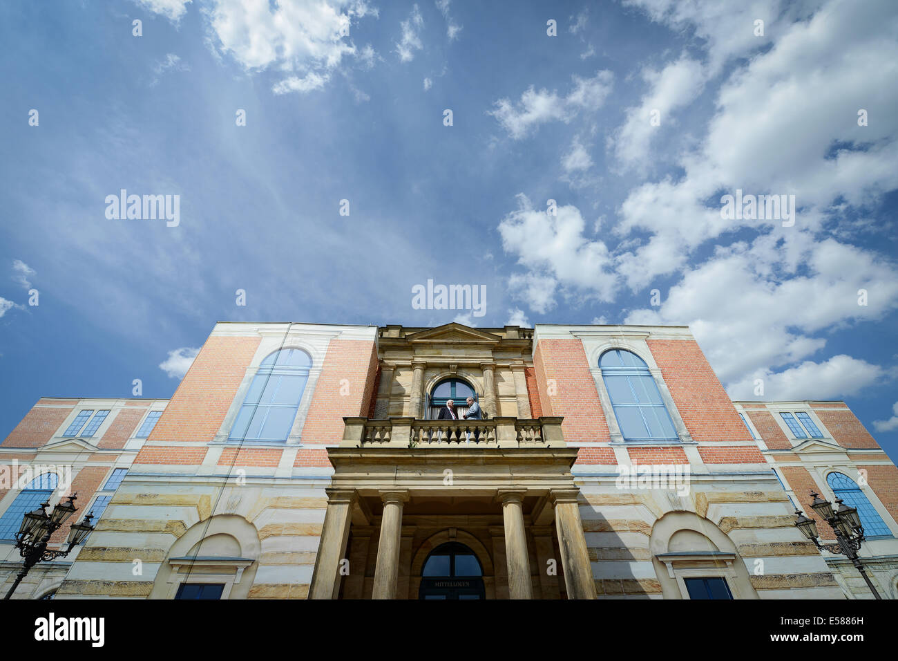 Bayreuth, Germany. 22nd July, 2014. Guests of the final rehearsal stand on the balcony of the Bayreuth Festival Theatre in Bayreuth, Germany, 22 July 2014. Last year the festival presented a new production of 'Der Ring des Nibelungen' (The Ring of the Nibelung) which will run again this year. Photo: DAVID EBENER/dpa/Alamy Live News Stock Photo