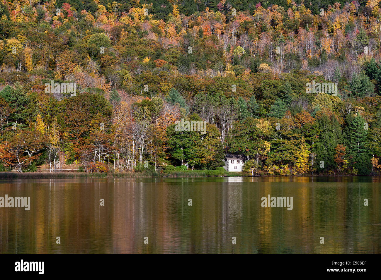 Seclude house on Echo Lake with autumn foilage, Vermont, USA Stock Photo