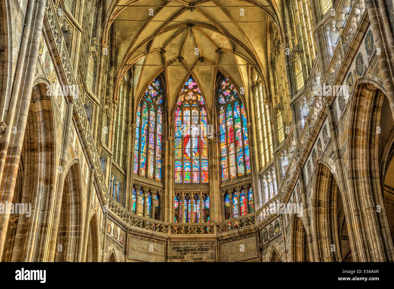 Stained windows in St. Vitus Cathedral located within Prague Castle Stock Photo