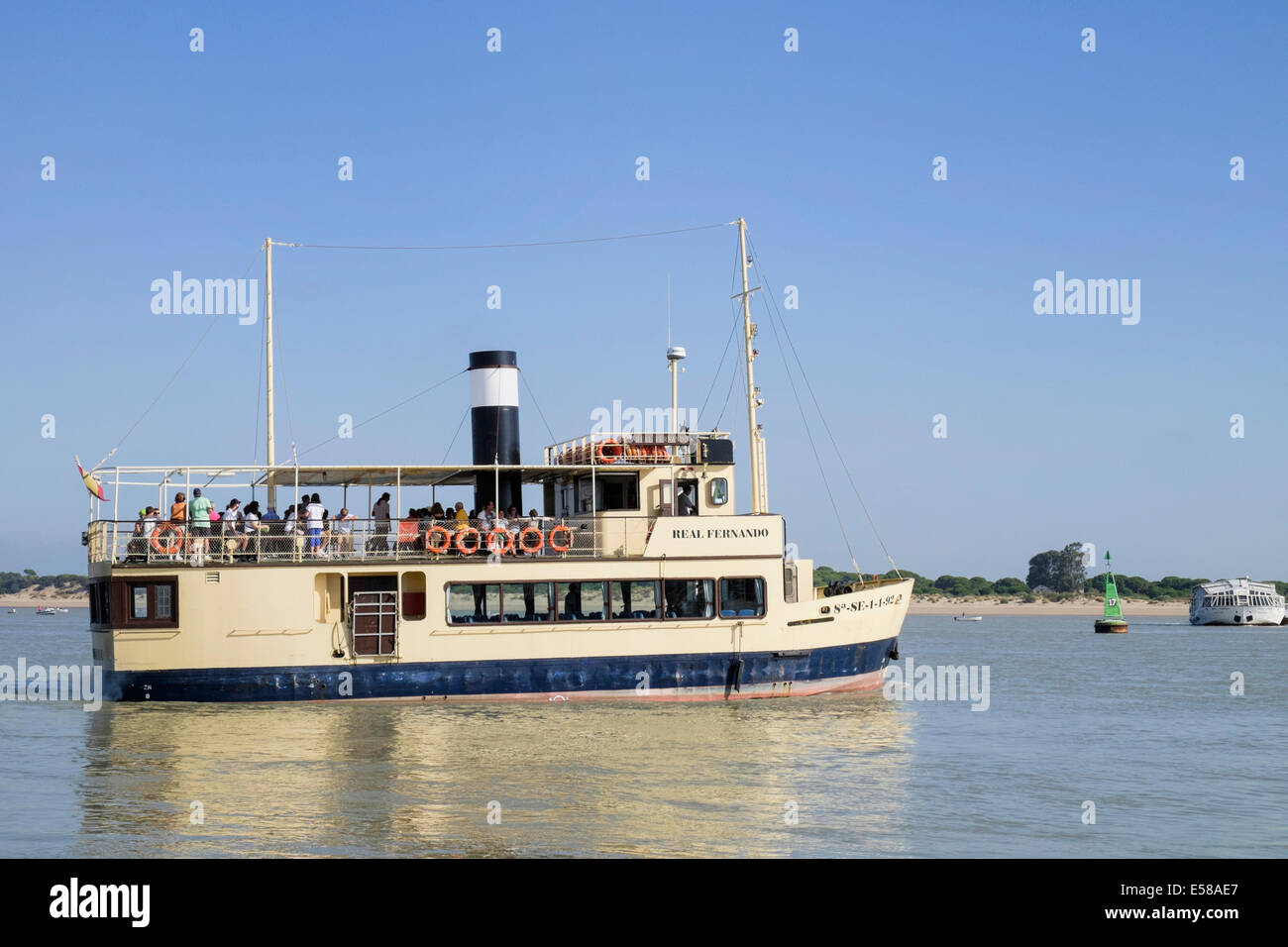 Ferryboat sets off from Sanlucar de Barremeda to cross the Guadalquivir river the Coto Donana nature reserve Stock Photo