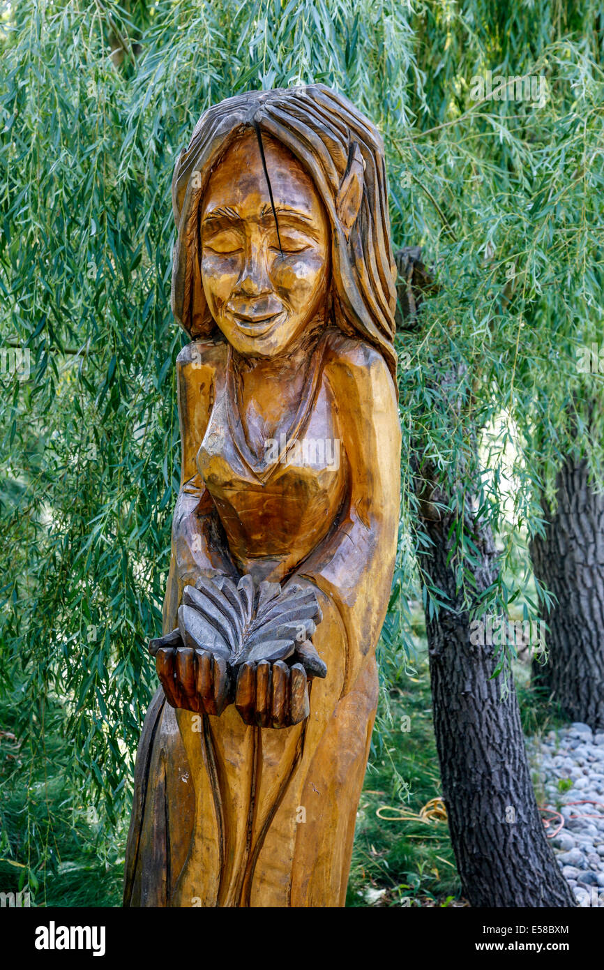 Canadian Chainsaw art carvings from dead trees as backyard decor on a Farm in Ontario Stock Photo