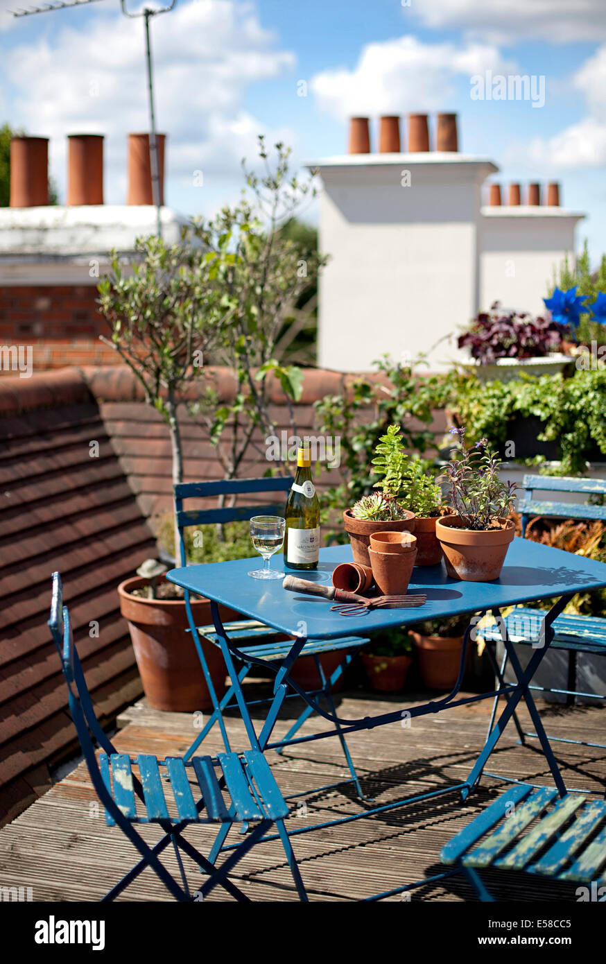 Blue table and chairs on rooftop garden in Primrose Hill, London, UK Stock Photo