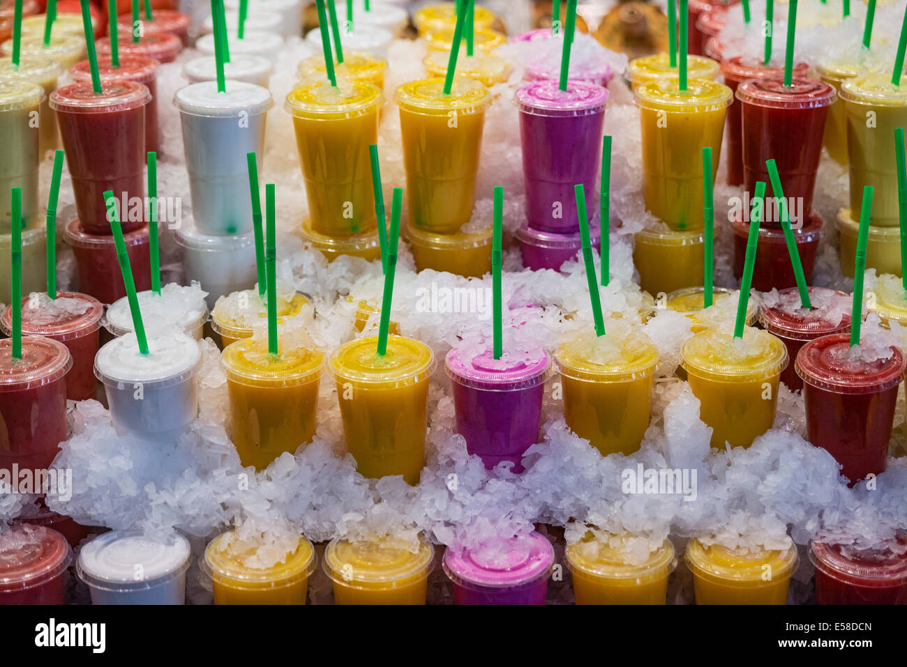 Fresh fruit smoothies for sale in a farm market. Stock Photo