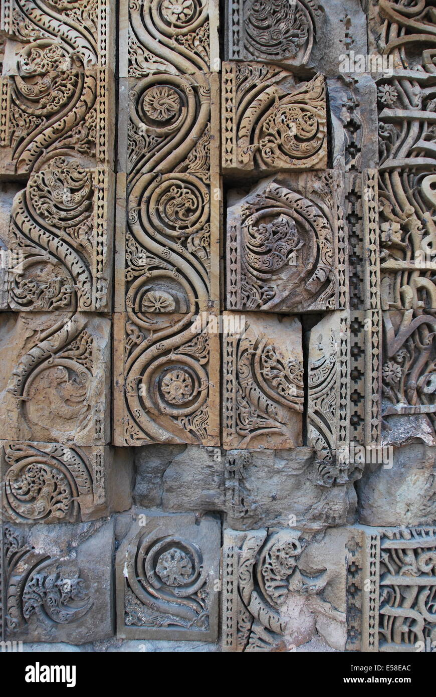 Qutab Minar. Mosque,.Delhi,.India.  The mosque with Hindu ornamentation stolen from Hindu temples. Sandstone carving detail. Stock Photo