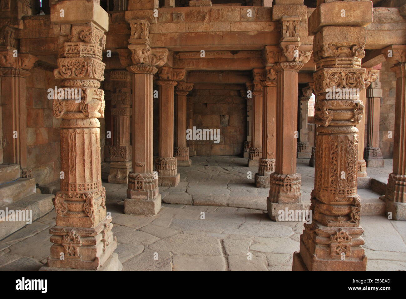 Qutab Minar. Mosque,.Delhi,.India.  The mosque with Hindu ornamentation stolen from Hindu temples. Sandstone carvings. Stock Photo