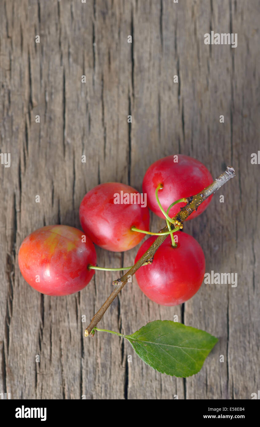 cherry-plum on wooden background Stock Photo