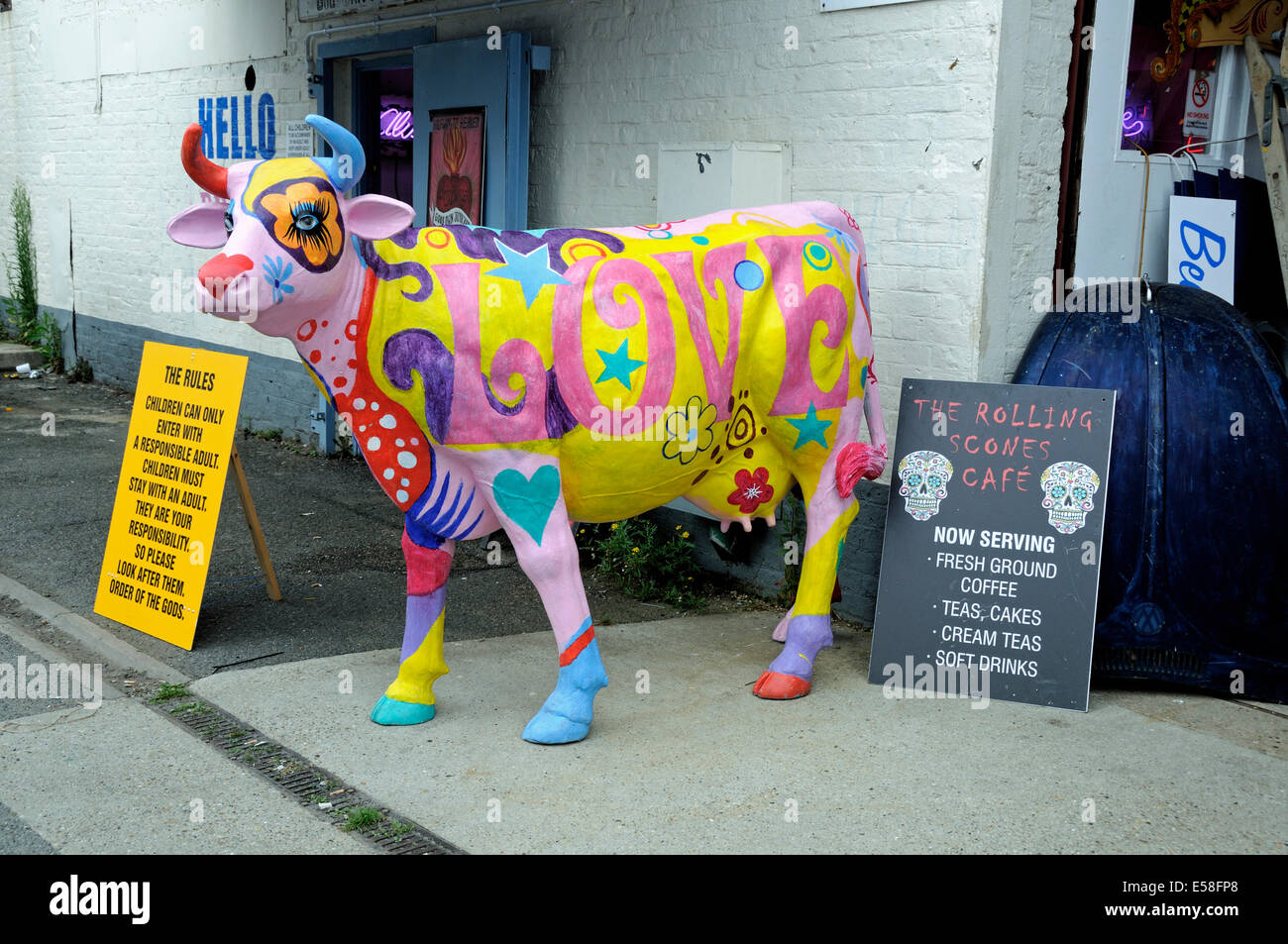 Colourful cow with LOVE painted on it's side outside The Rolling Scones Cafe, Walthamstow E17 London England Britian UK Stock Photo