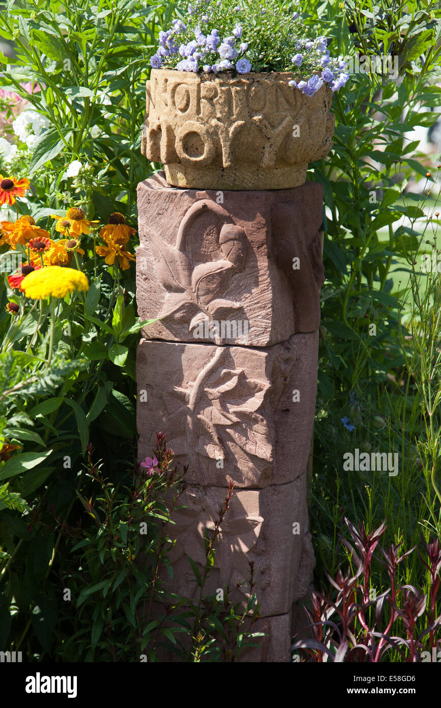 Tatton Park, Manchester, UK. 23rd July, 2014.  Norton Priory stone carved column, entry at the RHS - Royal Horticultural Society  carnival-themed event at Tatton Park.   Set in magnificent parklands, the RHS Flower Show Tatton Park is a celebration of the best in gardening with a vibrant carnival atmosphere.  The flower show opened to RHS members on Wednesday, before the full public opening on Thursday through to Sunday. Stock Photo