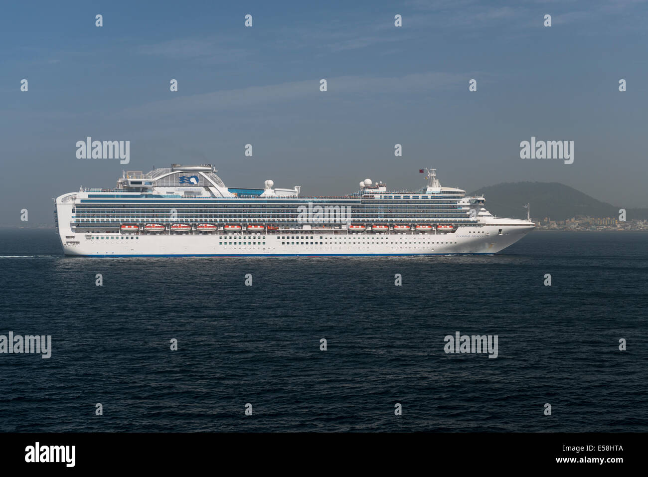 The luxury Cruise Ship Diamond Princess approaching Jeju Island, South Korea Stock Photo