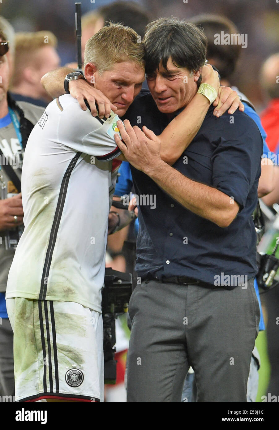 Rio de Janeiro, Brazil. 13th July, 2014. Bastian Schweinsteiger (L) of Germany celebrates with head coach Joachim Loew after winning the FIFA World Cup 2014 final soccer match between Germany and Argentina at the Estadio do Maracana in Rio de Janeiro, Brazil, 13 July 2014. © Action Plus Sports/Alamy Live News Stock Photo