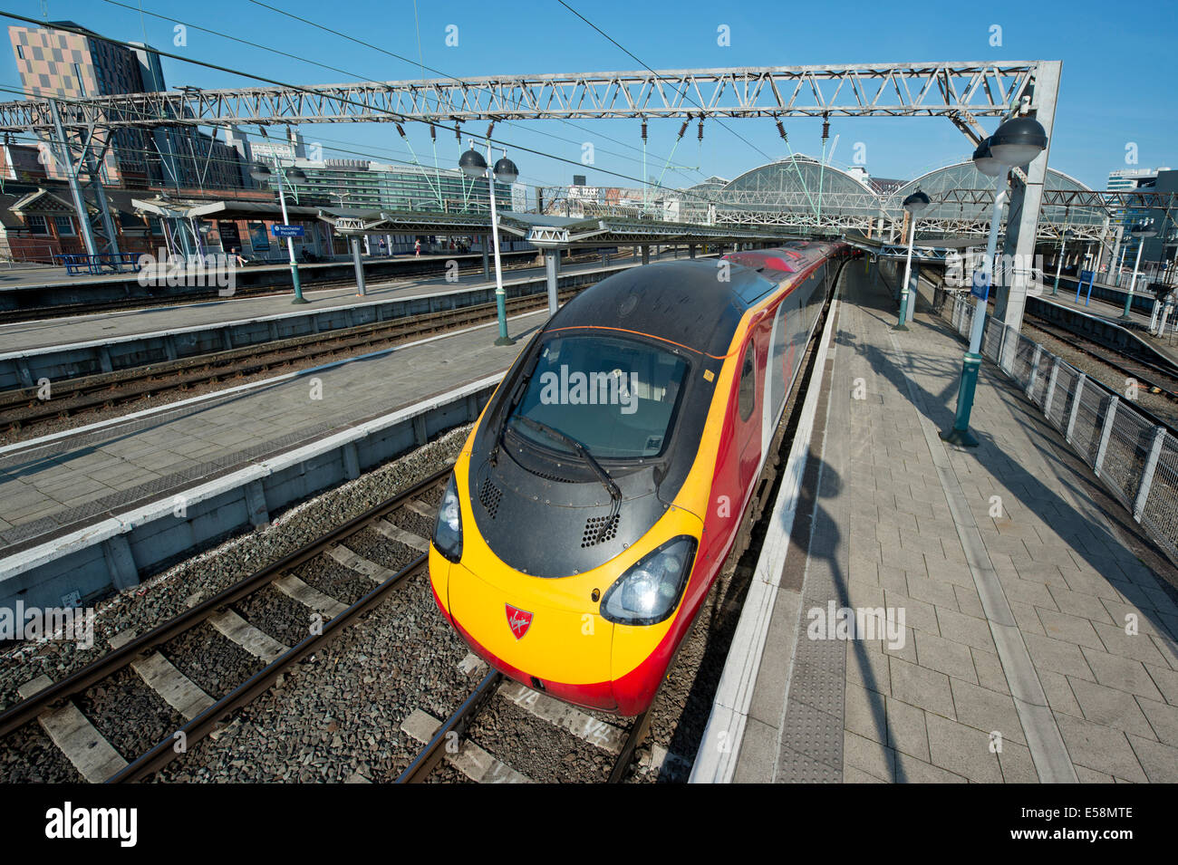 A Virgin Class 390 Pendolino train in the platform of Manchester Piccadilly Rail Station. Stock Photo