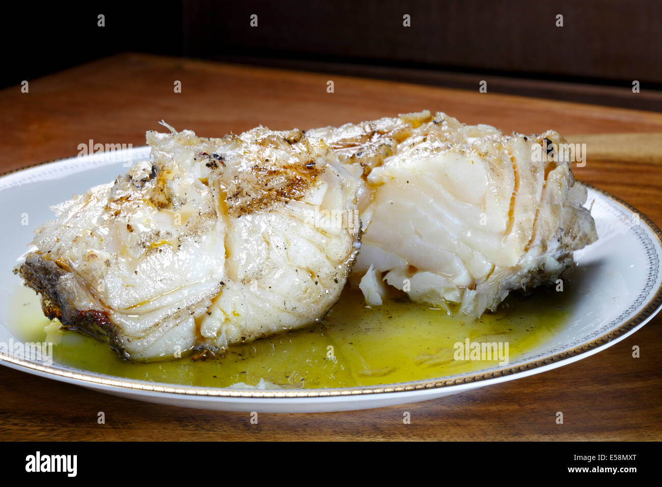 Baked cod with olive oil Stock Photo Alamy