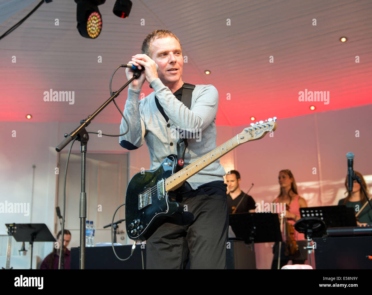 Glasgow, Scotland, UK. 23rd July, 2014. Stuart Murdoch of Belle and Sebastian performs at the kelvingrove bandstand as part of opening celebrations of the Glasgow Commonwealth Games 2014. Glasgow Scotland July 23rd. Credit:  Sam Kovak/Alamy Live News Stock Photo