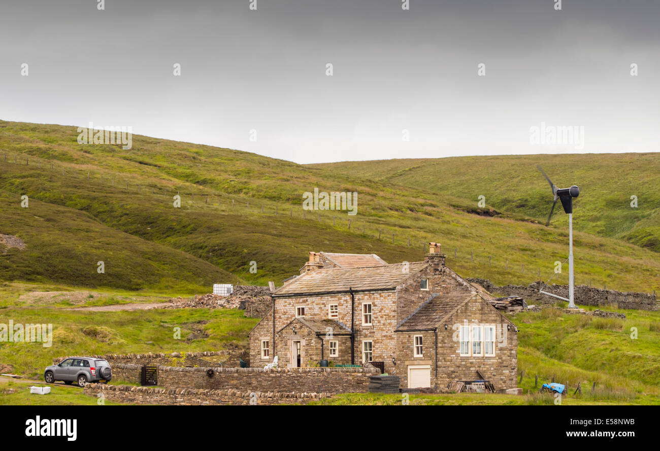 A remote moorland house at the head of Allen Dale, powered by a wind turbine, northumberland, UK. The house is at around 550 metres above sea level Stock Photo
