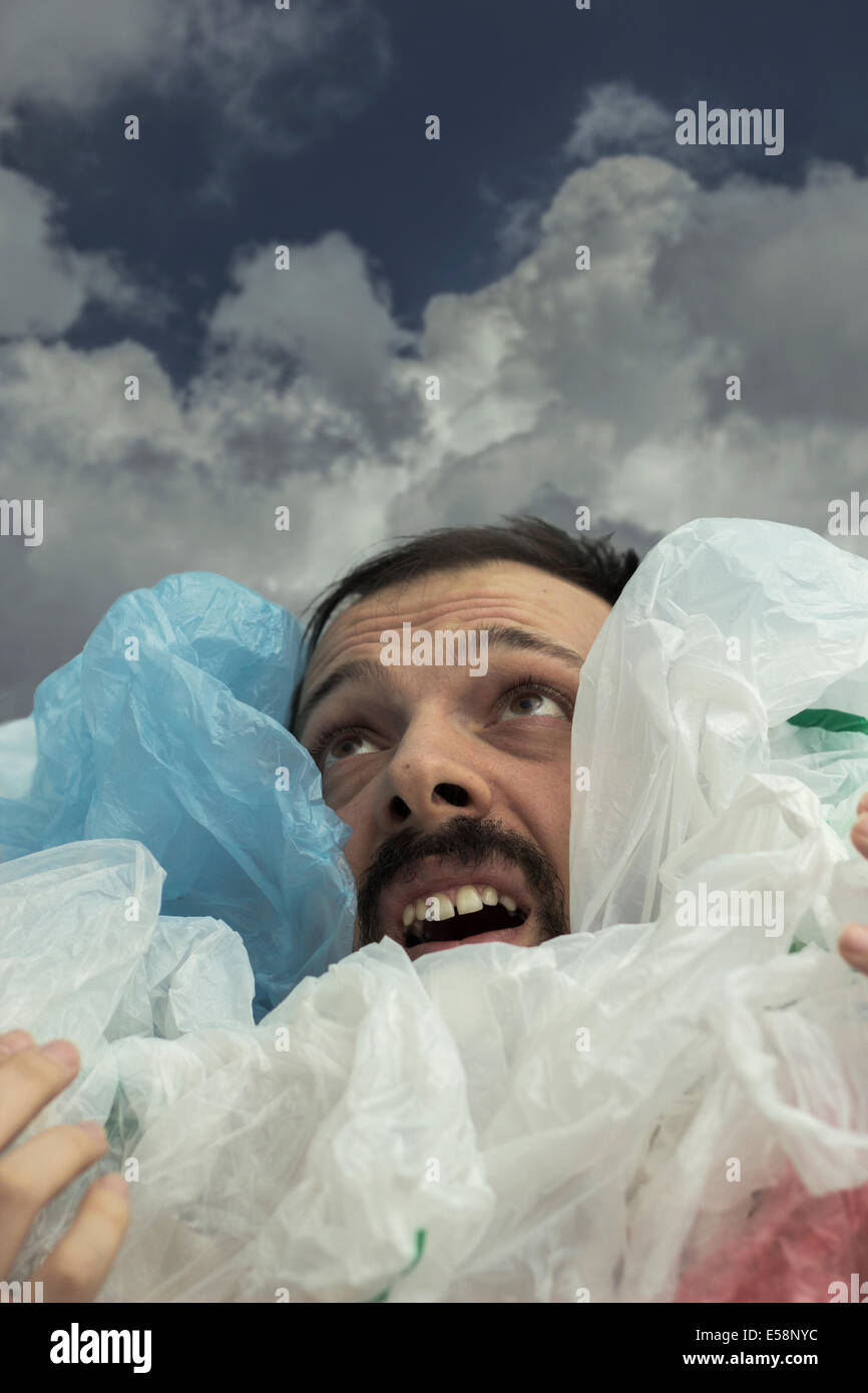 Eco concept - Drowning in garbage Stock Photo