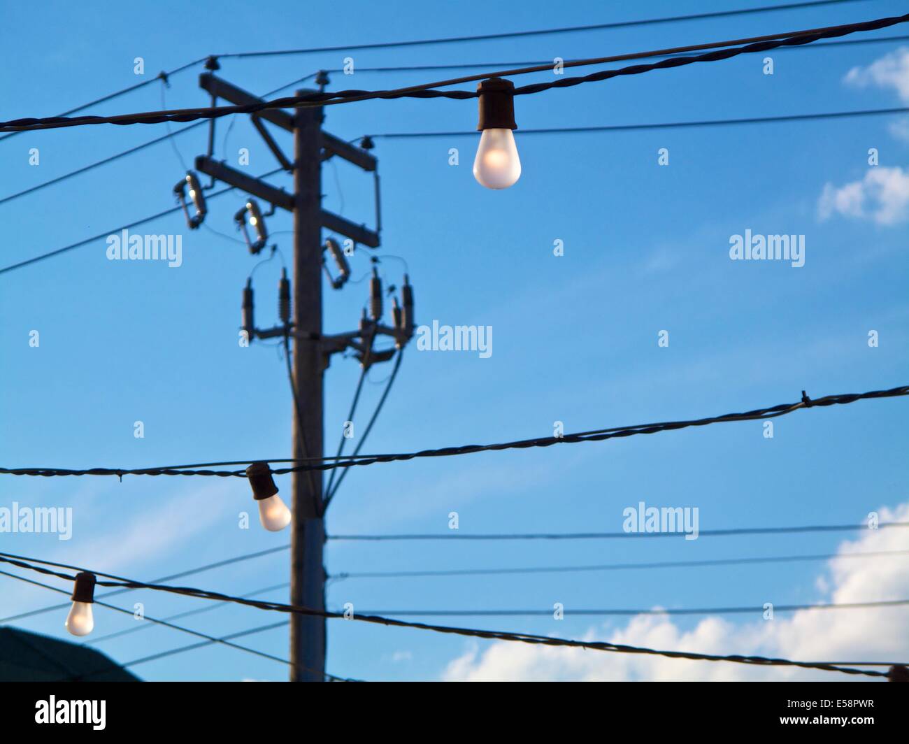 Incandescent lights strung outside Stock Photo Alamy