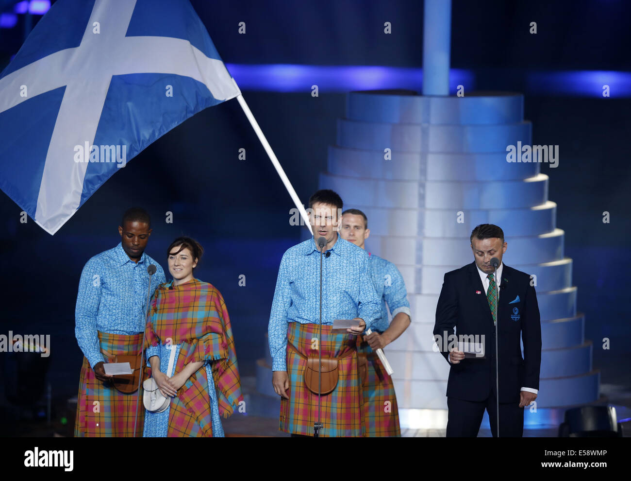Glasgow, Scotland, UK. 23rd July, 2014. Libby Clegg (2nd L) of Scotland and her guide Mikhail Huggins (1st L), Donald McIntosh (C), coach of Scotland's 2010 Shooting team and Wrestling Technical Official Victor Keelan take oath during the opening ceremony for the XX Commonwealth Games at the Celtic Park in Glasgow, Britain, on July 23, 2014. Credit:  Wang Lili/Xinhua/Alamy Live News Stock Photo