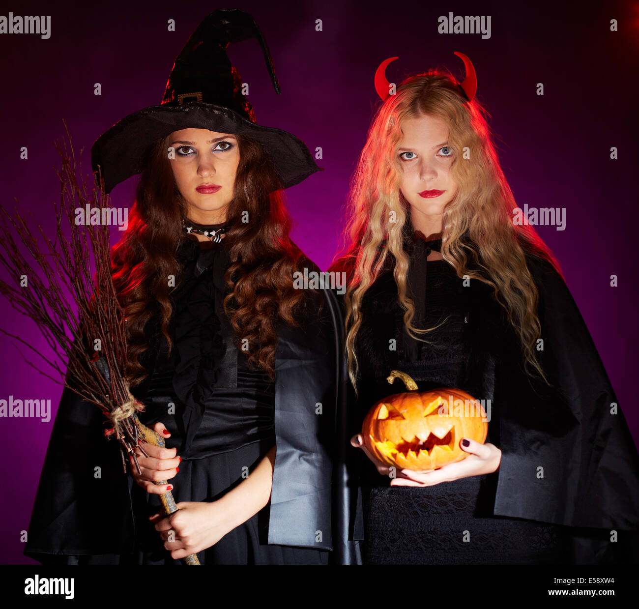 length portrait against a white background of a woman with green body paint  dressed up in a witch costume for Halloween making a scary face at camera  Stock Photo - Alamy