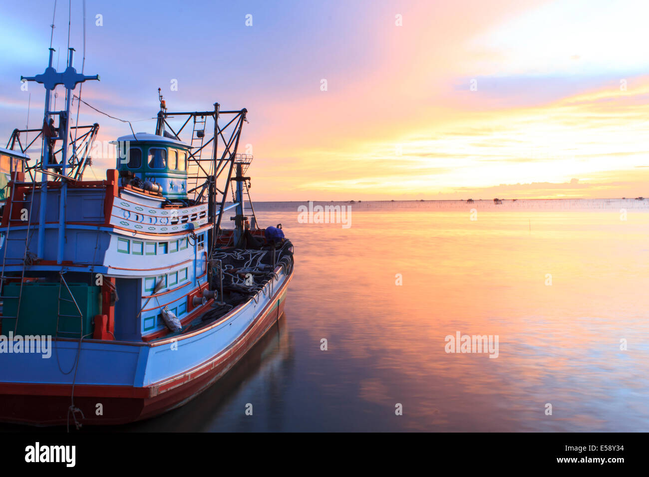 Fishing boat on the beach when sunset Stock Photo Stock Photo - Alamy