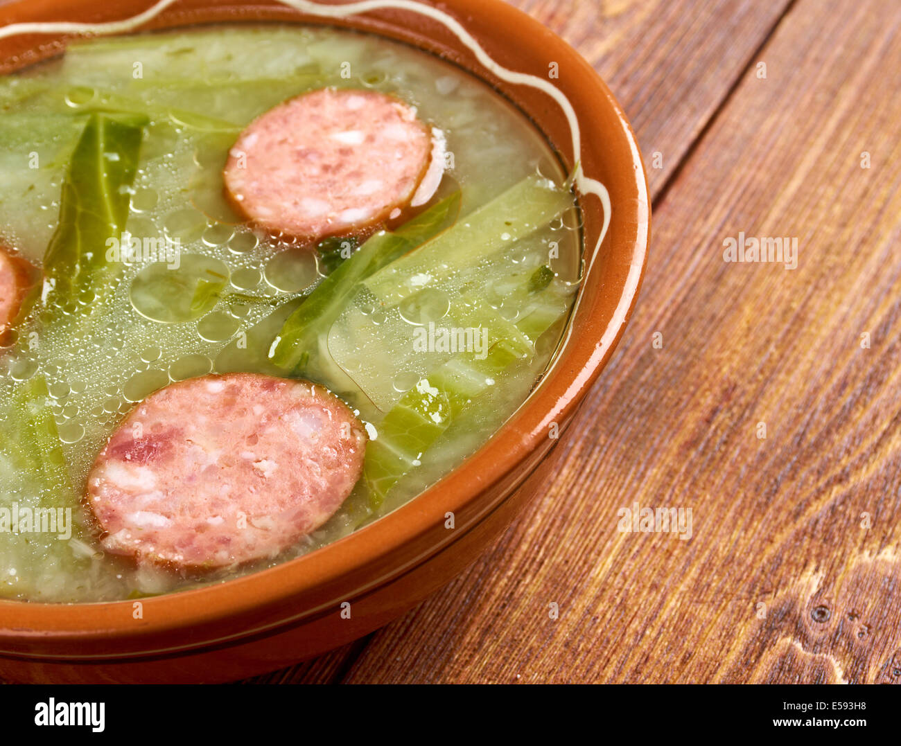 Caldo verde popular soup in Portuguese cuisine. traditional ingredients for caldo verde are potatoes, collard greens , olive oil Stock Photo