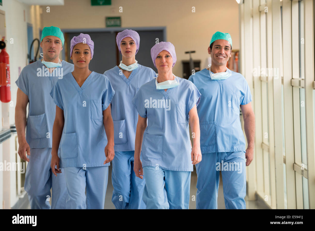 Medical team walking in the corridor of a hospital Stock Photo - Alamy