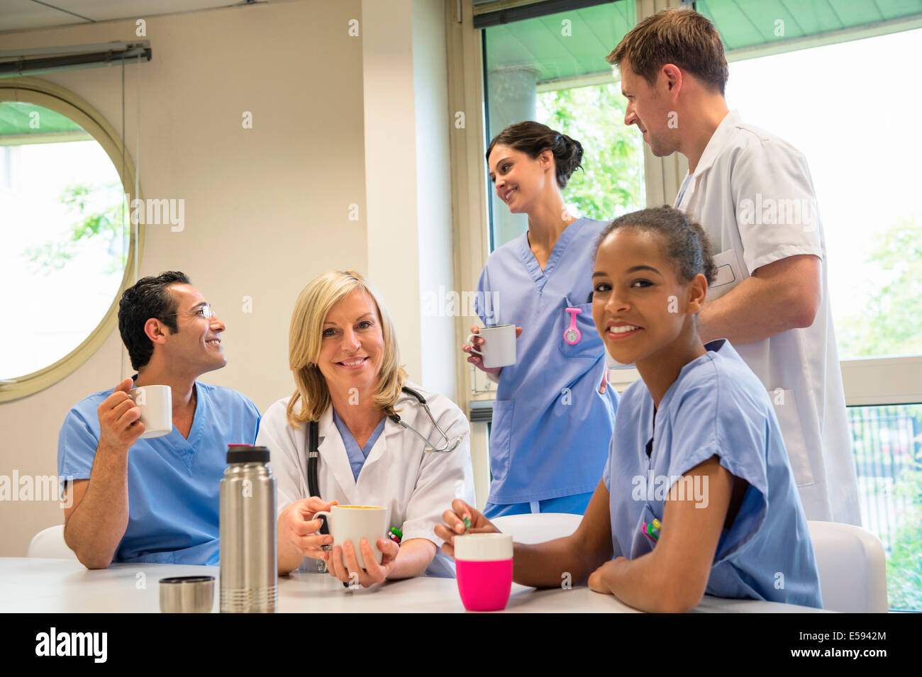Doctors and nurses having coffee break in hospital canteen Stock Photo