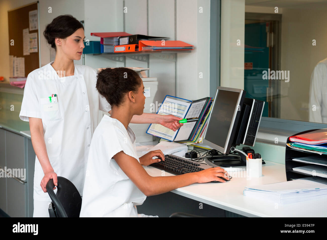 Female nurses working in office Stock Photo Alamy