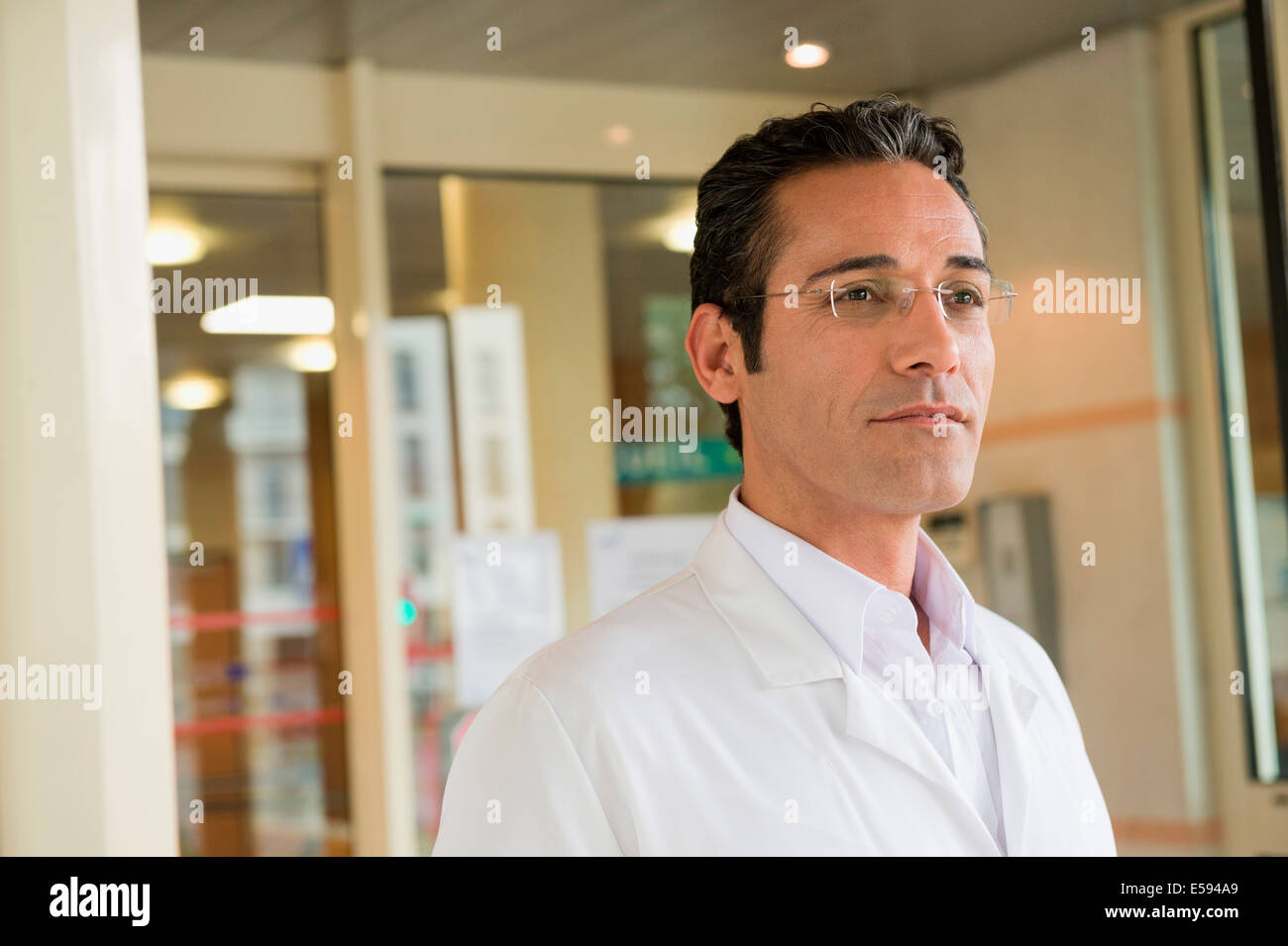 Doctor standing in front hi-res stock photography and images - Alamy