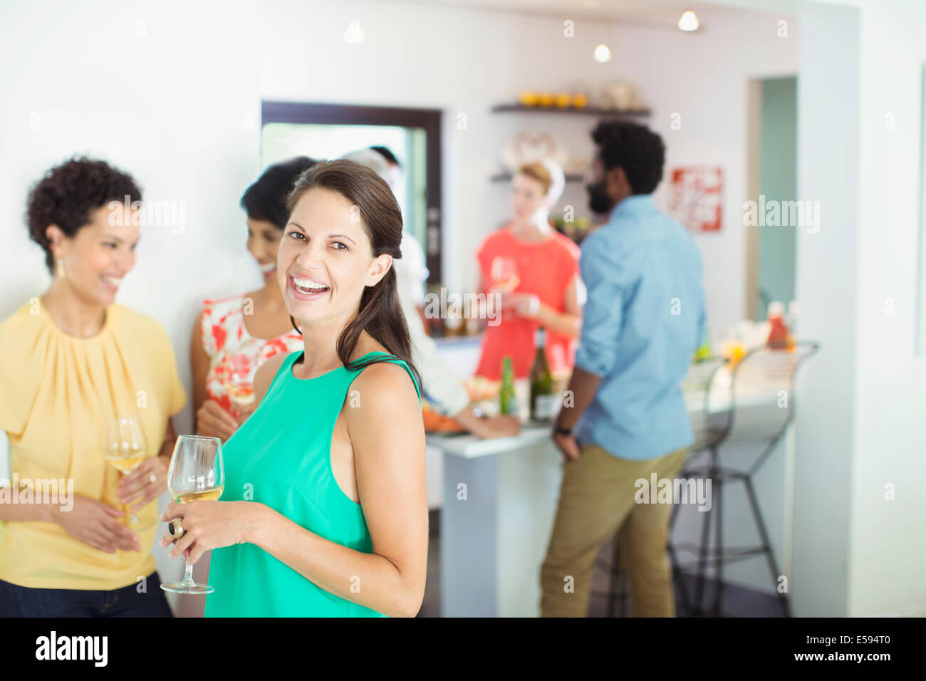 Woman laughing at party Stock Photo