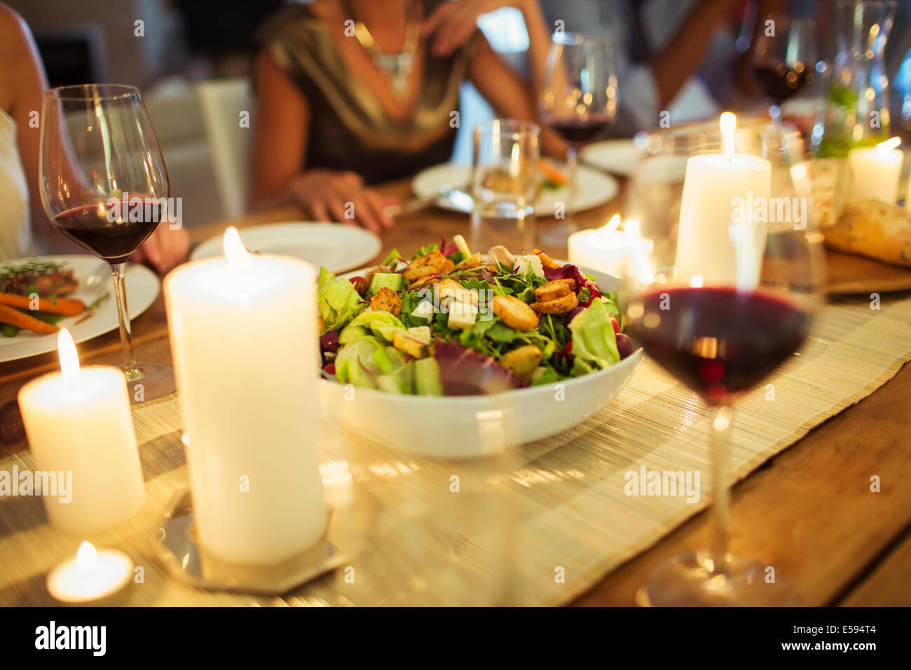 Salad bowl on table at dinner party Stock Photo