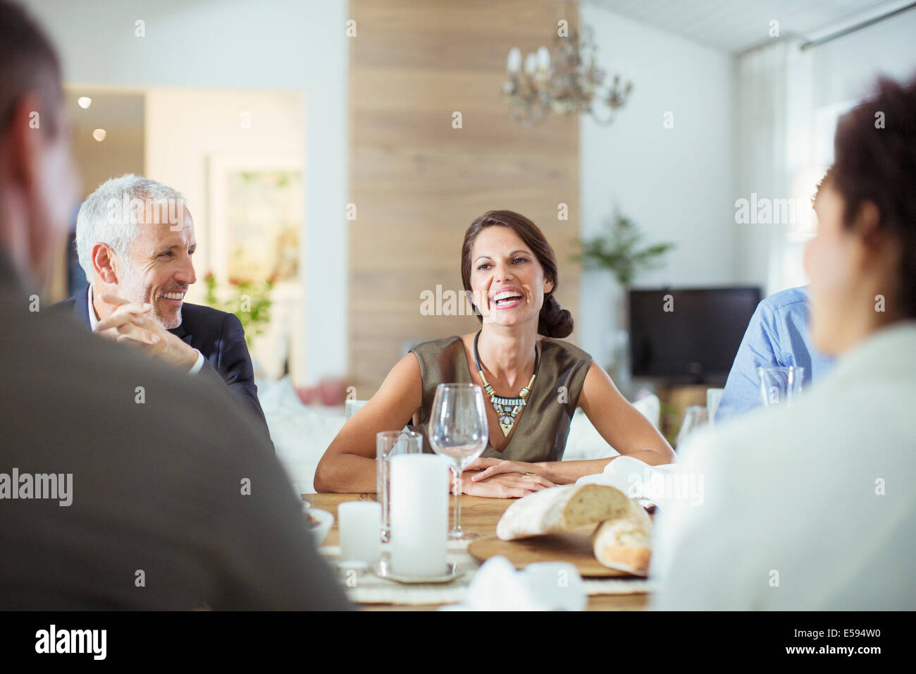 People talking at dinner party Stock Photo