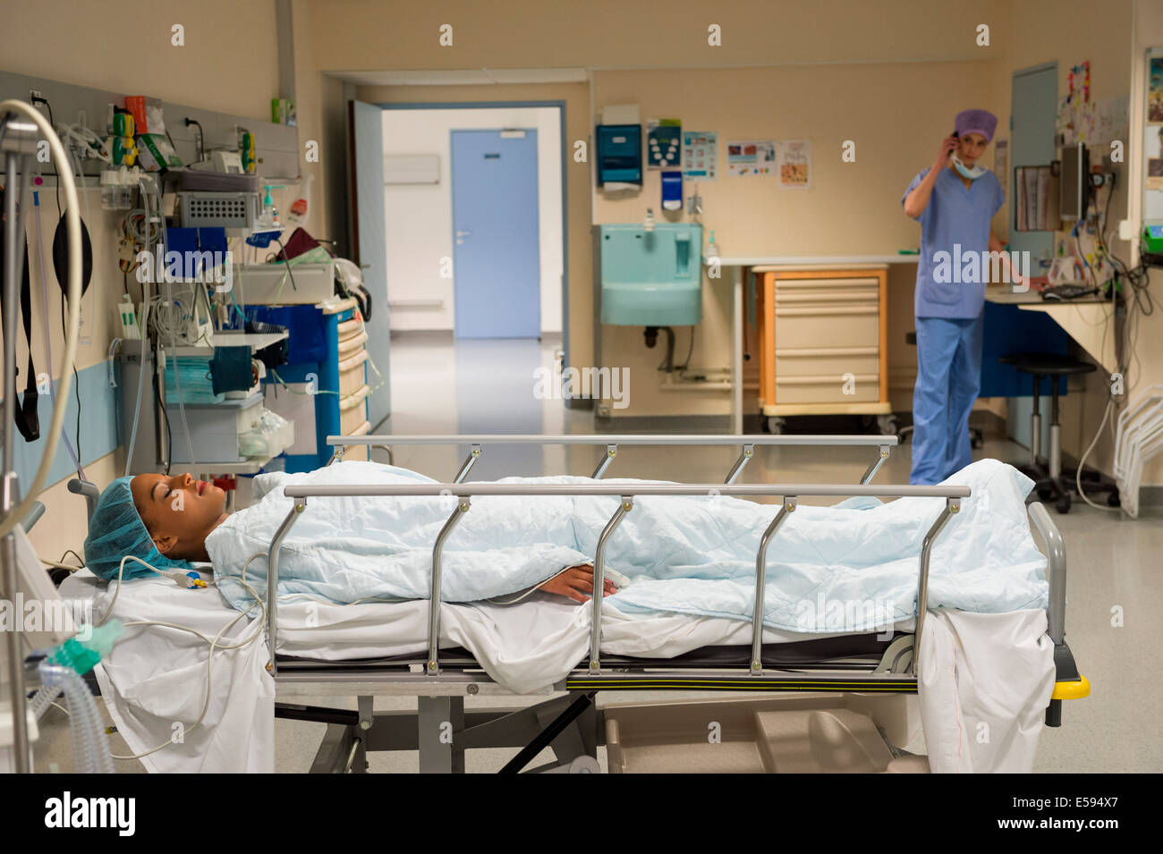 Female patient in recovery room Stock Photo