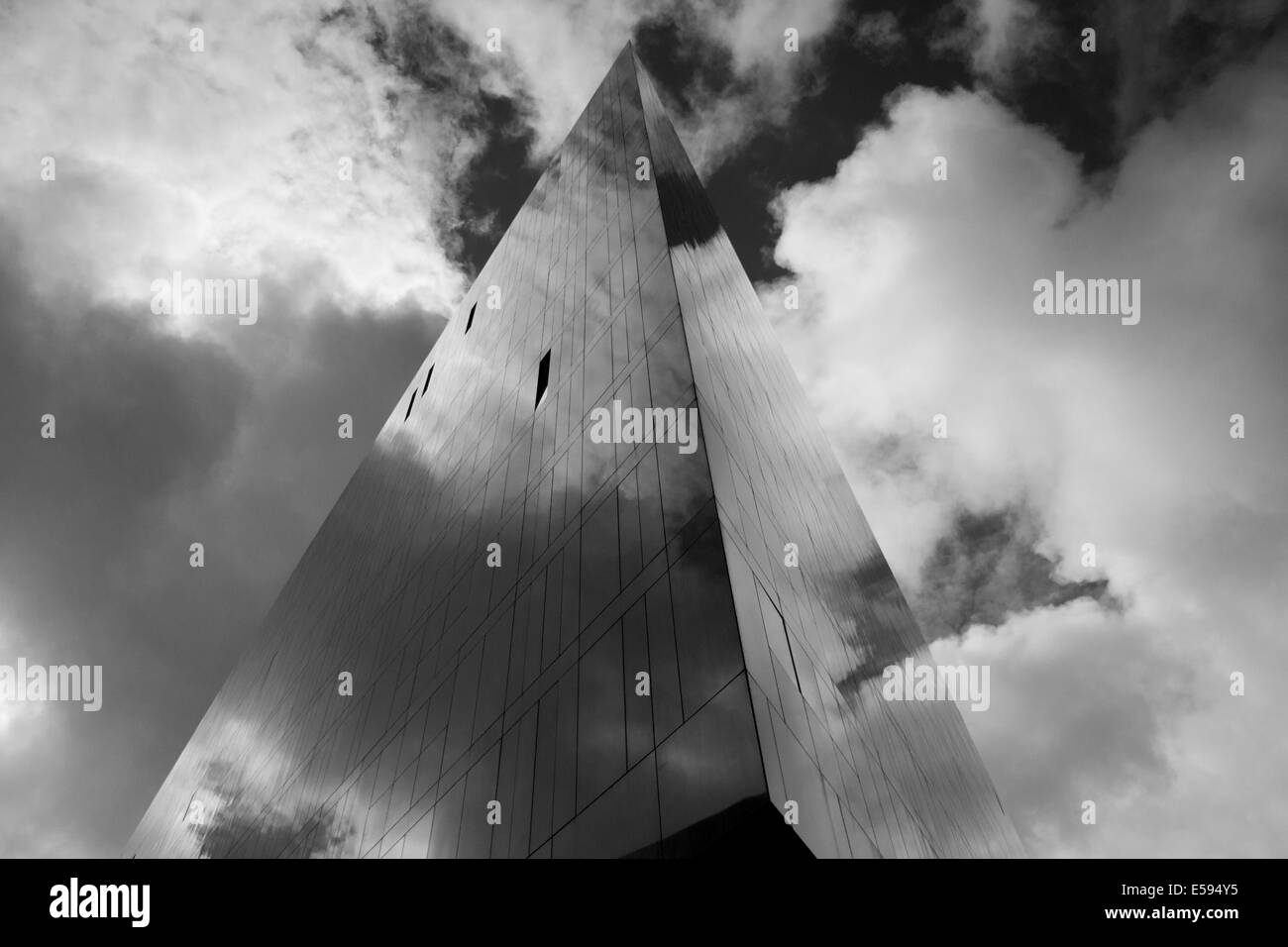 A surreal geometric image of Mann Island in Liverpool Docks, reflecting the sky. Stock Photo