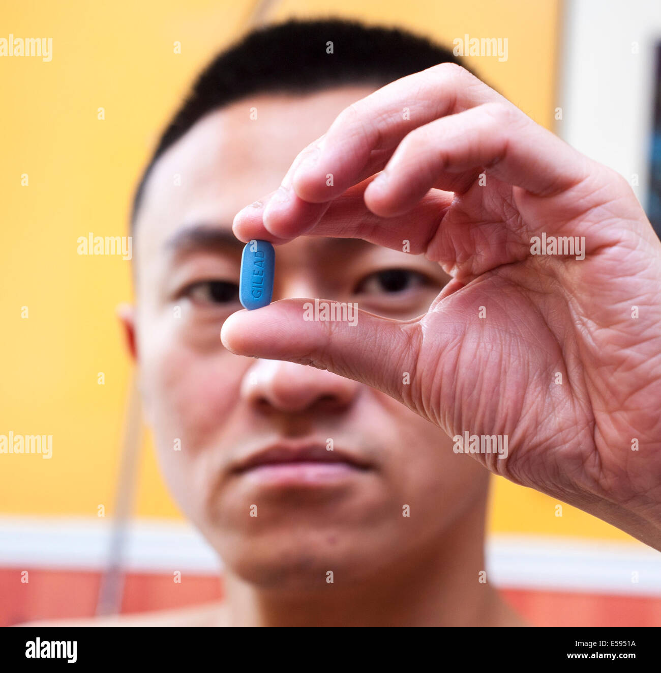 Man Holding Truvada Pill, HIV AntiViral medication, in Hand, AIDS HIV