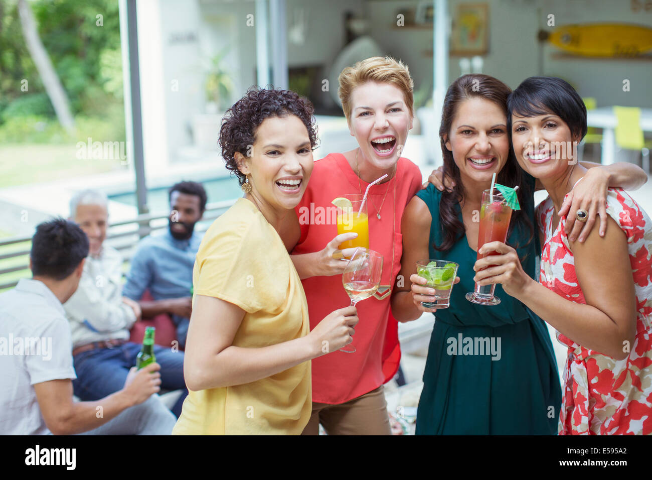 Women laughing at party Stock Photo