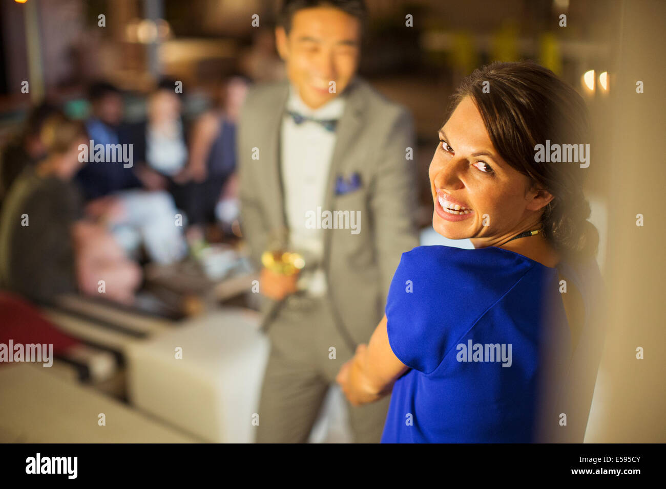 Woman laughing at party Stock Photo