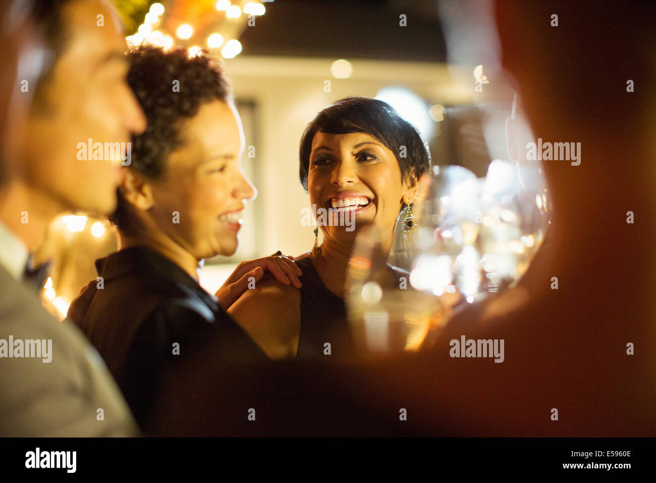 Women laughing at party Stock Photo