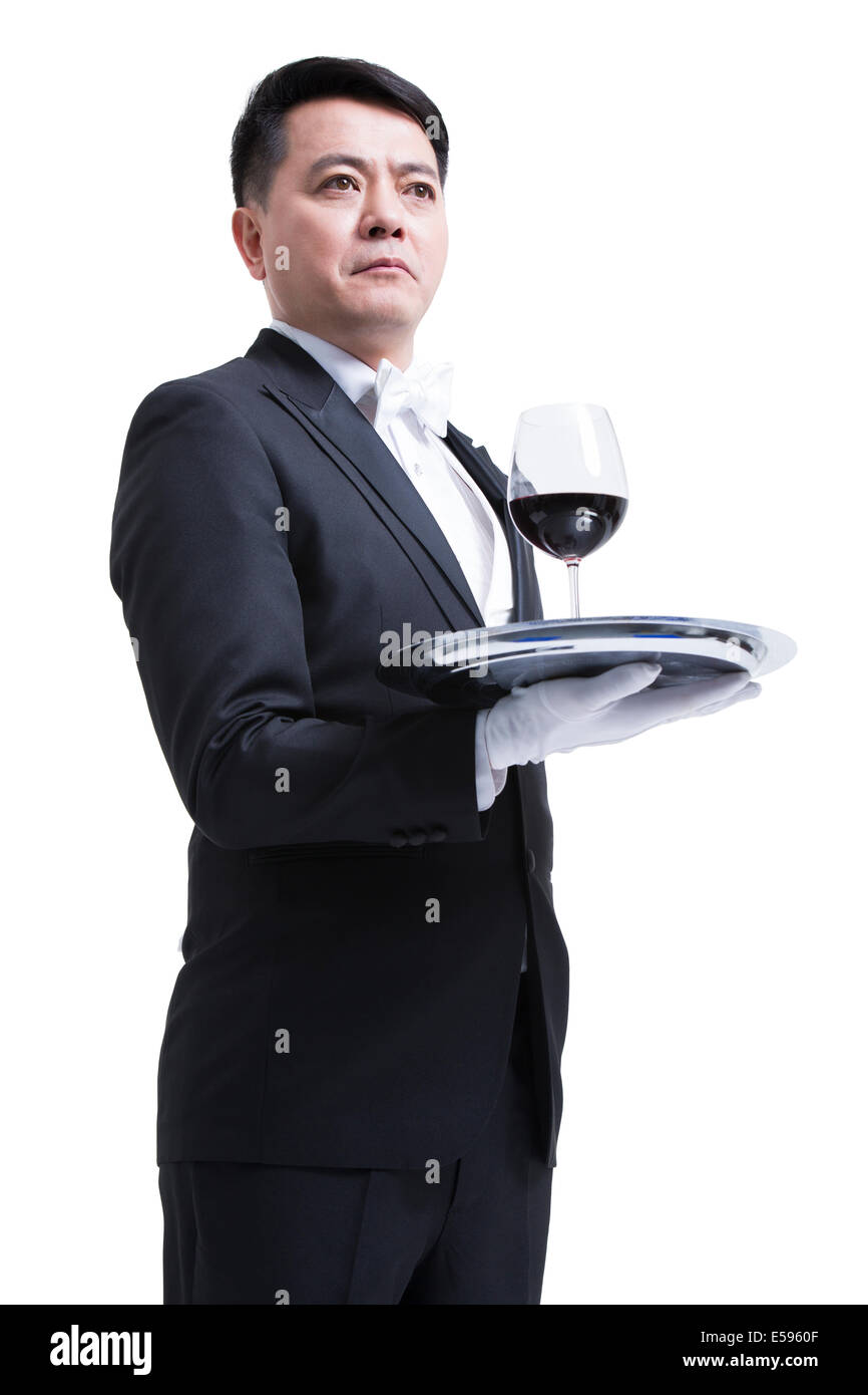 Waiter serving wine Stock Photo Alamy