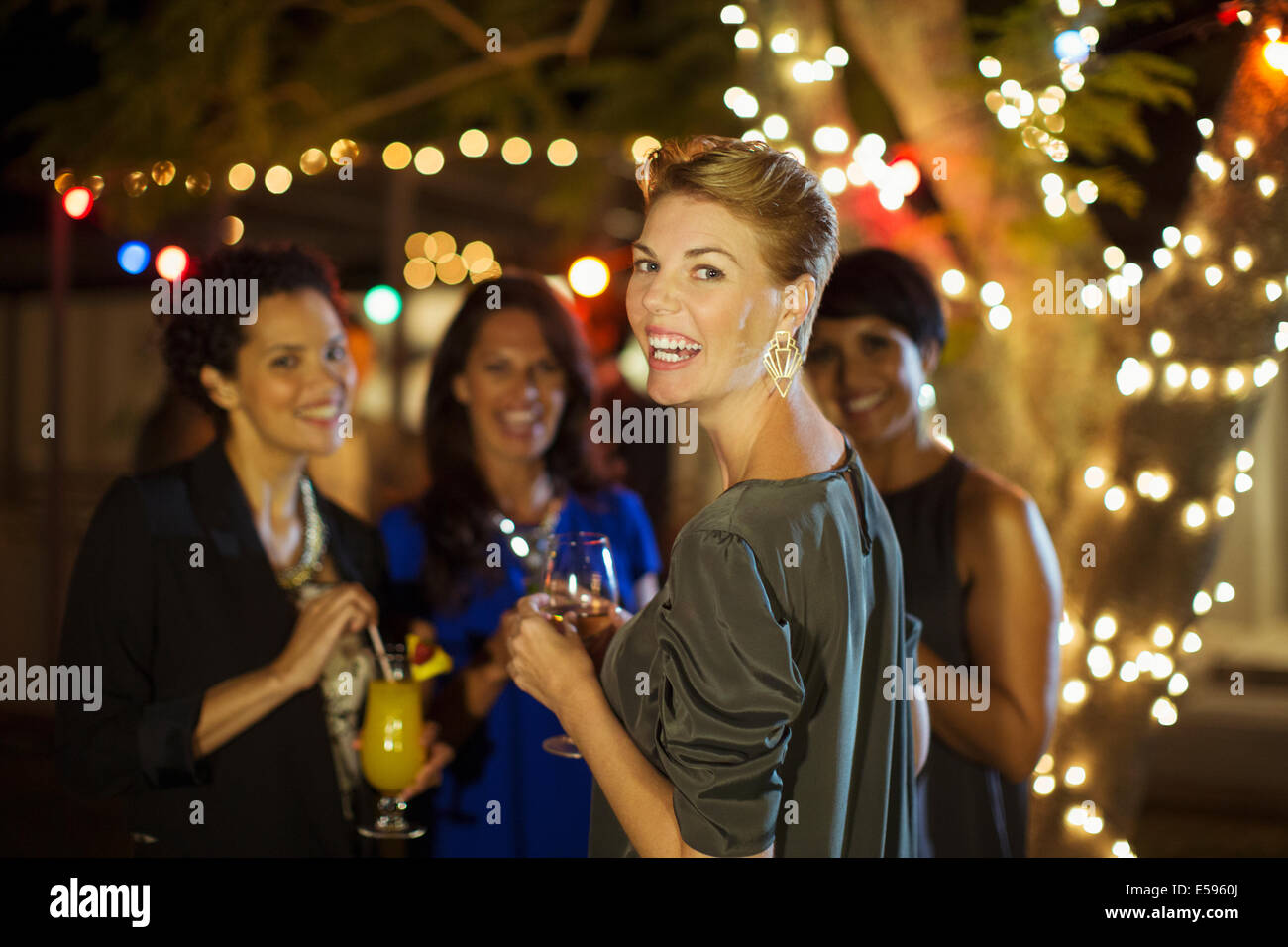 Women talking at party Stock Photo