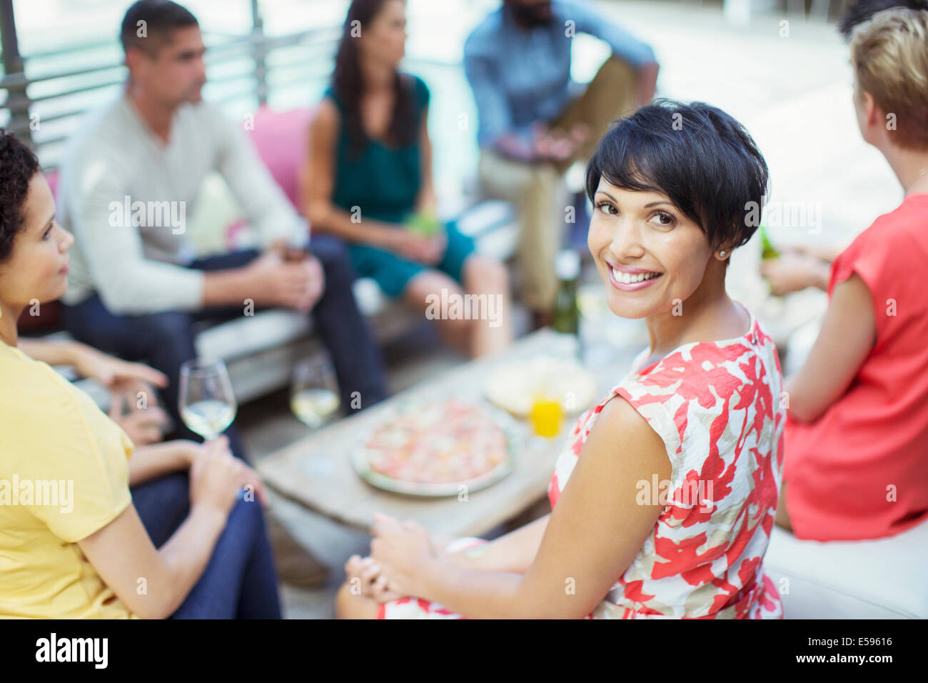 Woman smiling at party Stock Photo