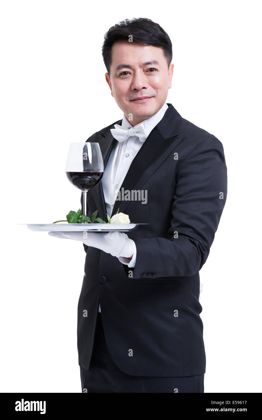 Waiter serving wine Stock Photo Alamy