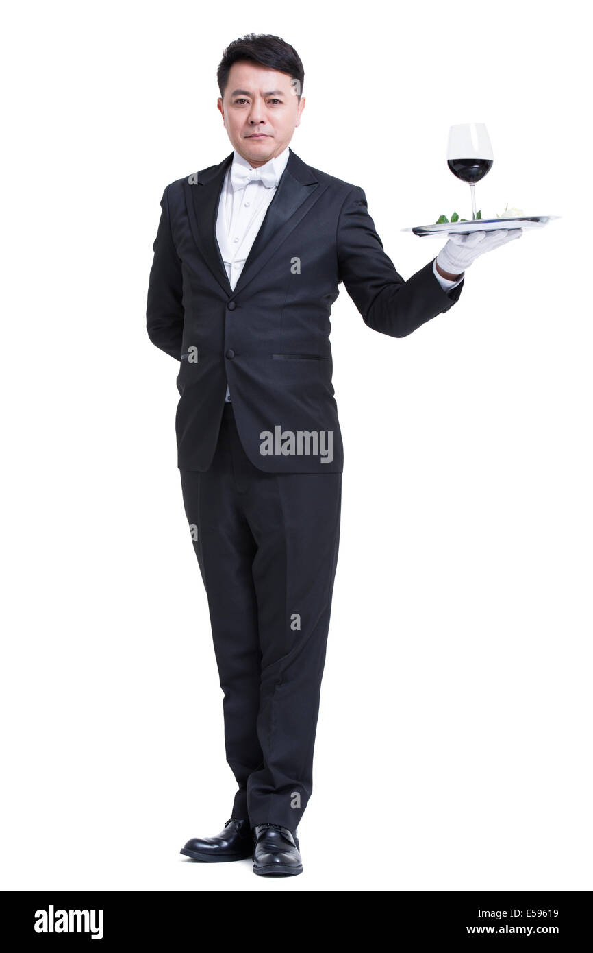 Waiter serving wine Stock Photo Alamy