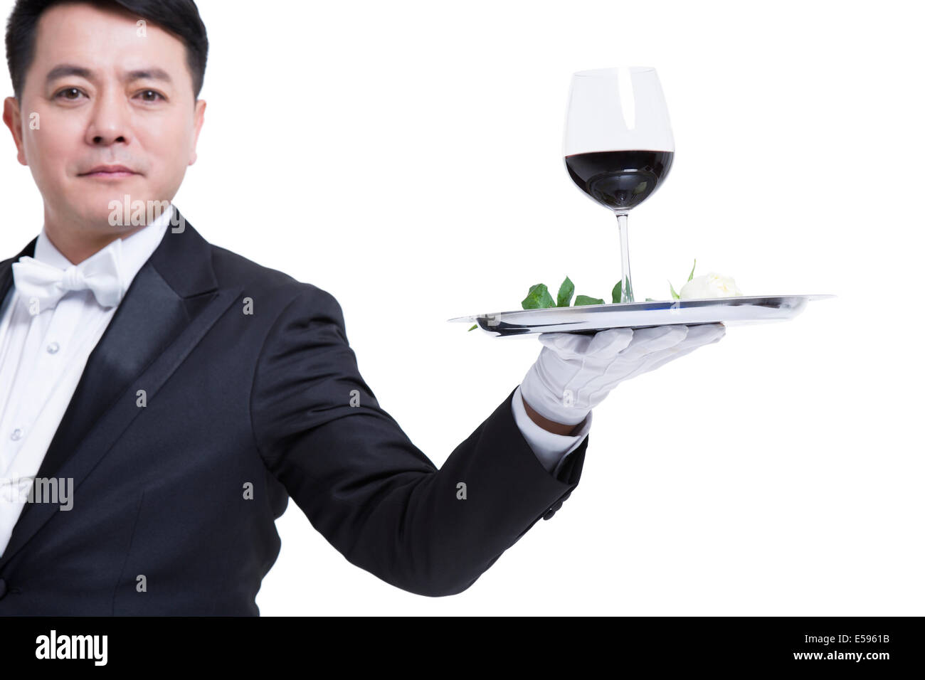 Waiter serving wine Stock Photo Alamy