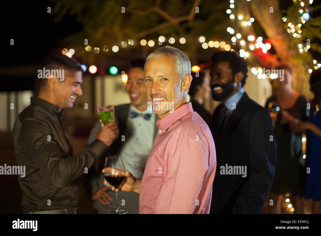 Man smiling at party Stock Photo