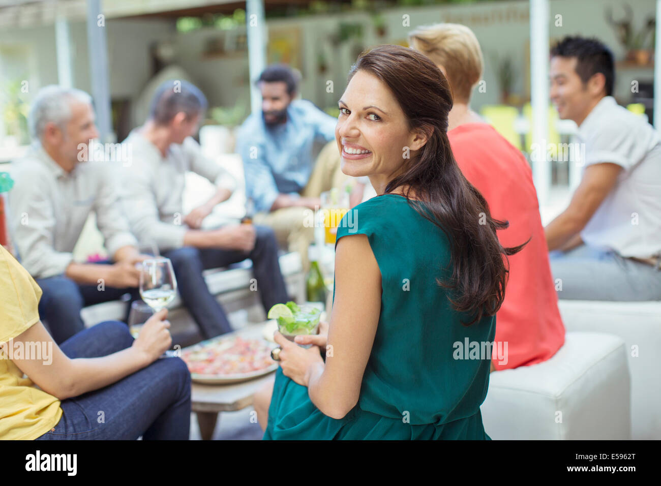 Woman smiling at party Stock Photo