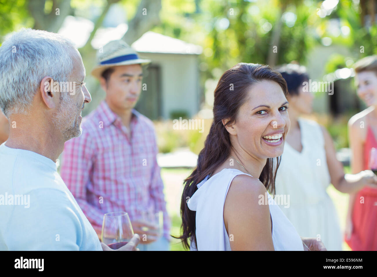 Woman laughing at party Stock Photo
